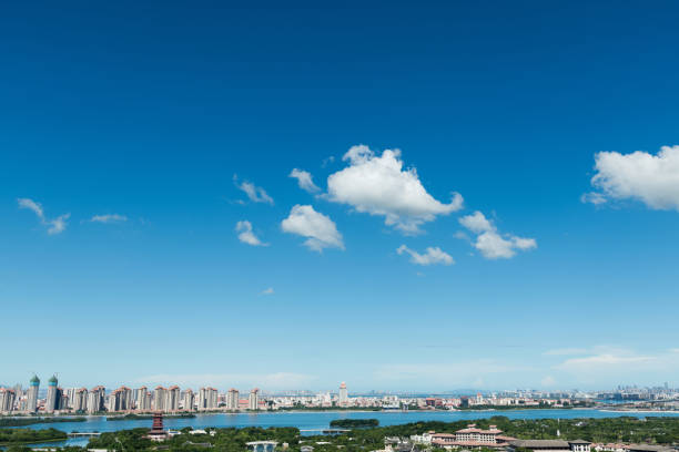 Landscape of city buildings under cloud sky.