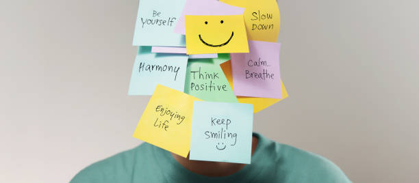 istock Mental Mind, Enjoying Life Concept. many Sticky Note on Face with Handwriting text. Happy Person 1283308913
