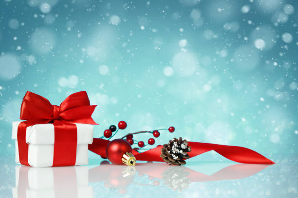 istock Decorative red gift box with a white bow with chtistmas decorations 1283310185