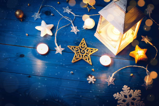 Burning lantern and christmas decoration in the evening. Happy New Year's card