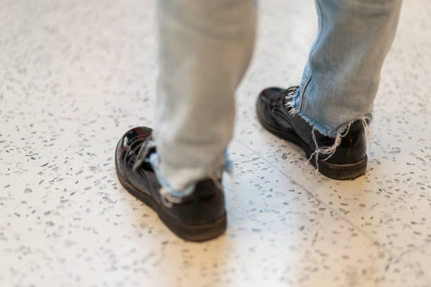 istock Little Girl Standing on the Floor Tiles 1283311005