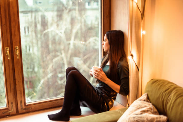istock sad woman at home for the lockdown at christmas 1283312135