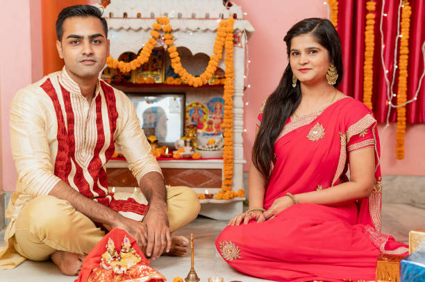 istock Indian young couple celebrating diwali 1283314850