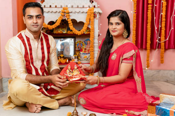 istock Indian young couple celebrating diwali 1283314851