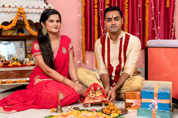 istock Indian young couple celebrating diwali 1283314865