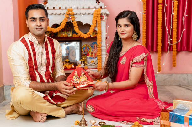 istock Indian young couple celebrating diwali 1283314879
