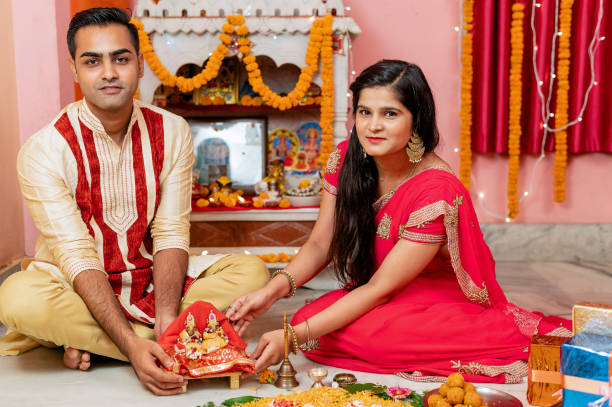 istock Indian young couple celebrating diwali 1283314885