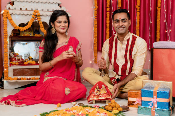istock Indian young couple celebrating diwali 1283314913