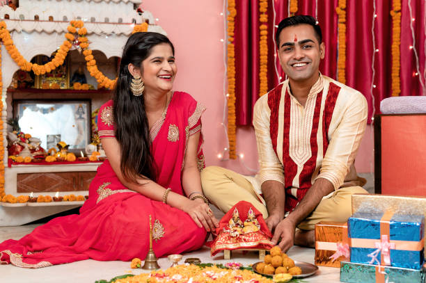 istock Indian young couple celebrating diwali 1283314931