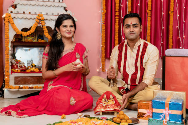 istock Indian young couple celebrating diwali 1283314954