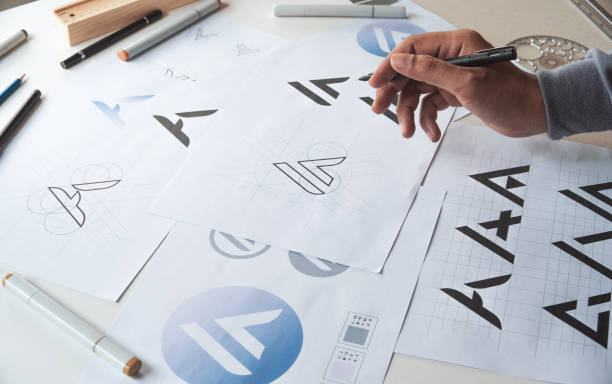 istock Graphic designer creative design sketch drawing logo Trademark brand Workspace 1283315948