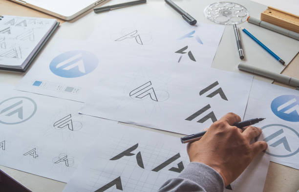 istock Graphic designer creative design sketch drawing logo Trademark brand Workspace 1283315950