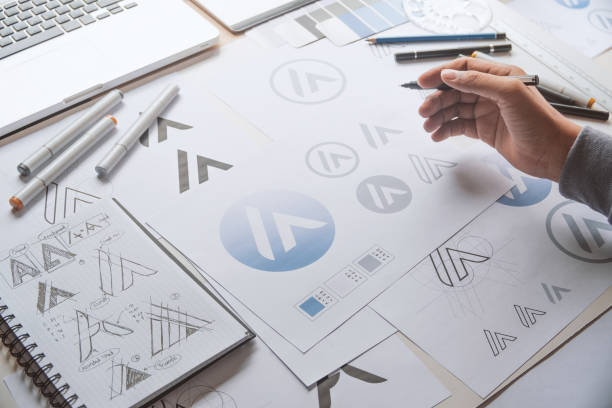 istock Graphic designer creative design sketch drawing logo Trademark brand Workspace 1283315951