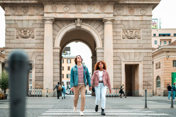 istock A young couple crossing the street 1283316681