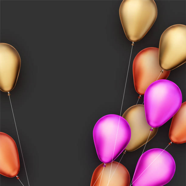 istock Yellow, orange and pink foil balloons with threads on black background. 1283317725