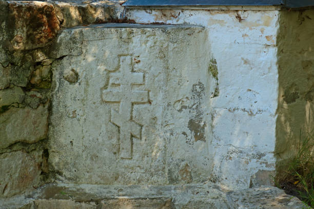 istock Cross carved in the rock 1283319100