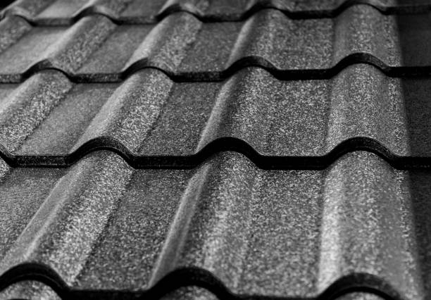 istock Gray metallic roof tiles background with light pattern. 1283319202
