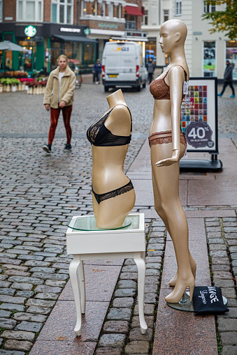 Aarhus, Denmark, October 21, 2020: Mannequin figure in female underwear outside a shop in the pedestrian street in the central part of Aarhus, the second largest city in Denmark