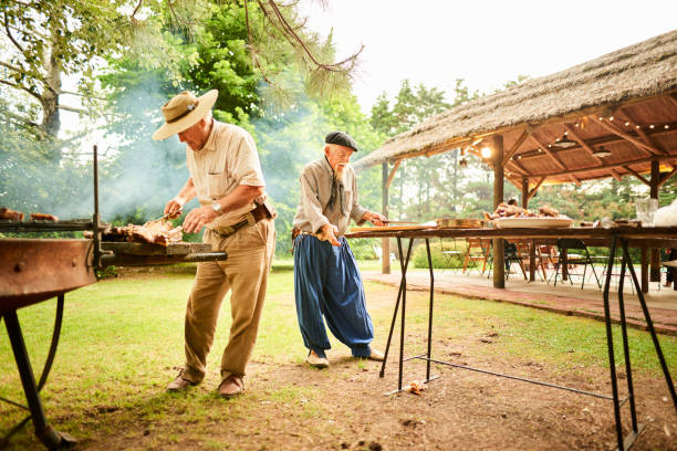 istock Two senior men barbecuing for a garden party 1283322301