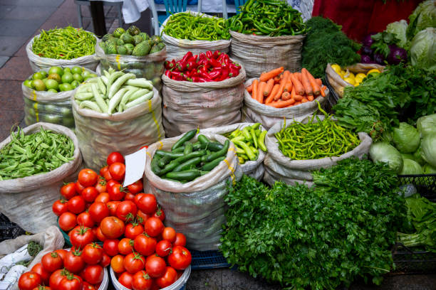 istock fresh vegetables standing in sack at market place 1283323122
