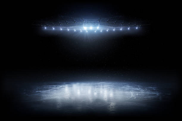 istock Background. Beautiful empty winter background and empty ice rink with lights. Spotlight shines on the rink. Bright lighting with spotlights. Isolated in black 1283323266