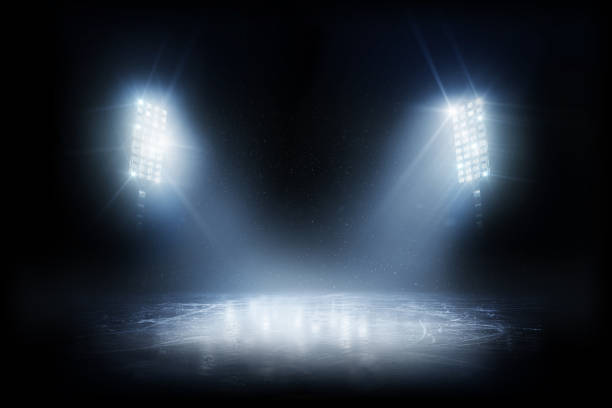 istock Beautiful ice background. Realistic ice and snow on dark background. Winter background. Spotlight shines on the rink. Bright lighting with spotlights 1283323269
