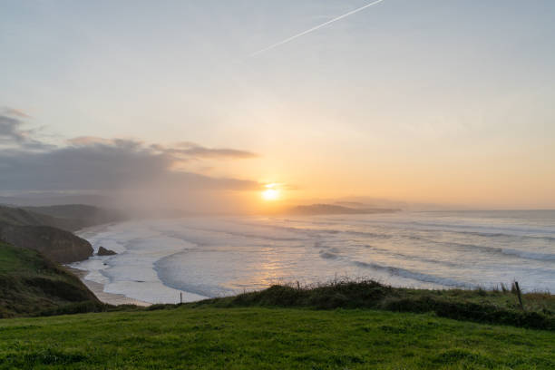 istock green grassy cliffs drop down to the ocean coast in northern Spain at sunset 1283324077