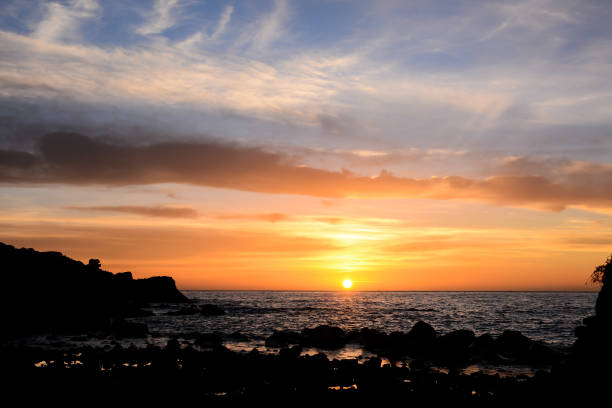 istock The Sun Setting in the Sea 1283325687