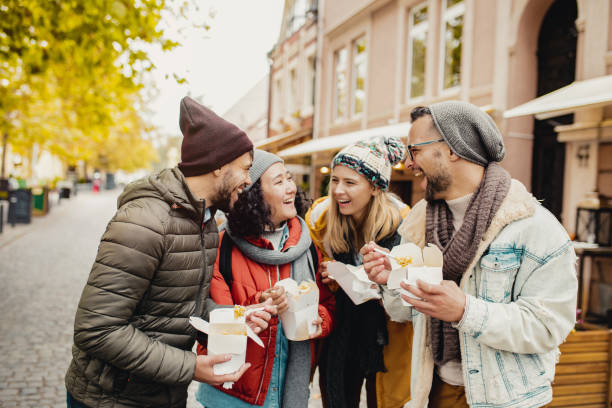 istock Friends outdoors eating fast food and having fun 1283328294