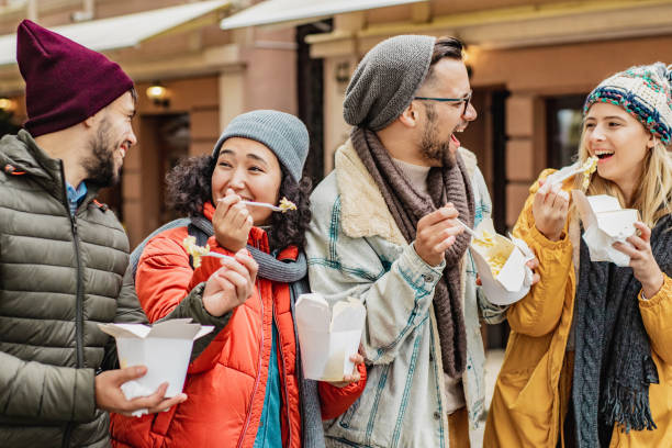 istock Friends outdoors eating fast food and having fun 1283328668