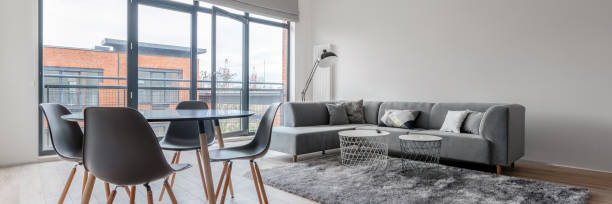 istock Living room with dining area, panorama 1283329635