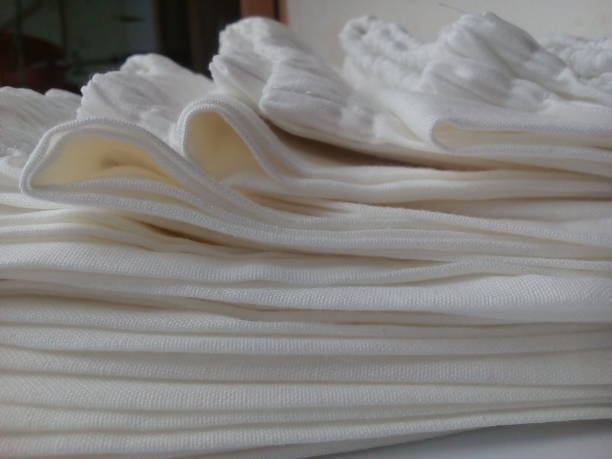 istock stacked folds of white trousers 1283330034