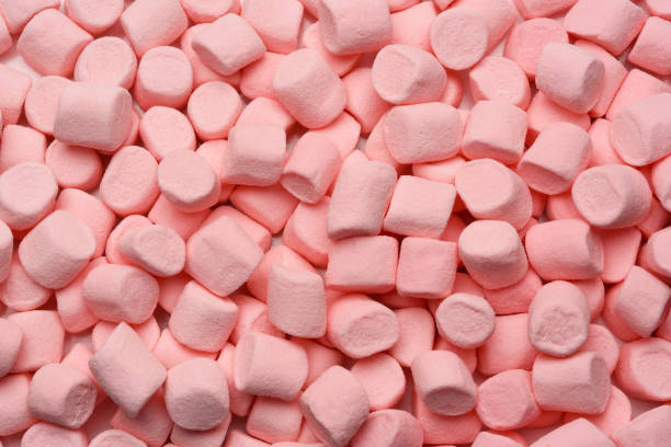 istock Pink mini marshmallows filling the frame 1283332799