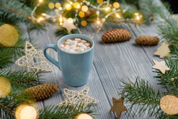 istock A mug of cocoa with marshmallows on a table with Christmas decorations 1283337093