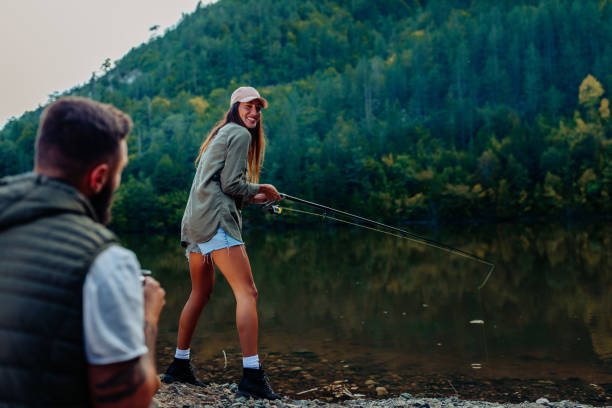 5,200+ Woman Fishing Rod Stock Photos, Pictures & Royalty-Free Images -  iStock