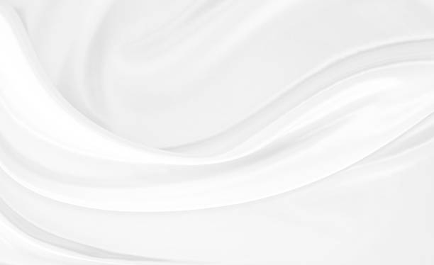 istock White gray satin texture that is white silver fabric silk background with beautiful soft blur pattern natural. 1283337934