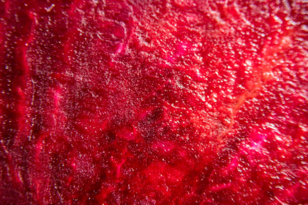 Macro background of beetroot sliced on white background