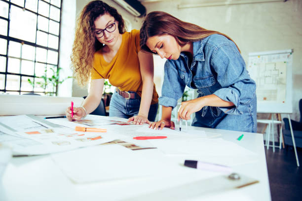 istock Two young female designers working together on a project 1283341545