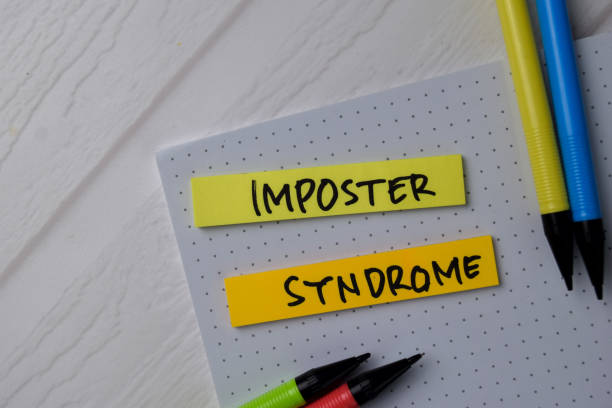 Imposter Syndrome text on sticky notes isolated on office desk Imposter Syndrome text on sticky notes isolated on office desk office fun business adhesive note stock pictures, royalty-free photos & images