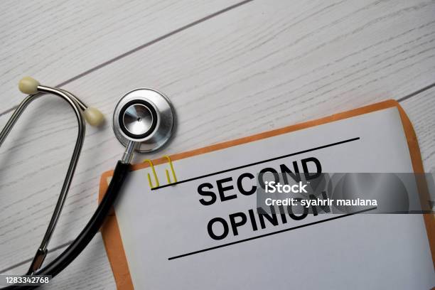 Second Opinion Text With Document Brown Envelope And Stethoscope Isolated On Office Desk Stock Photo - Download Image Now