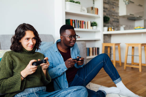 istock Happy young diverse couple relaxing at home 1283345908
