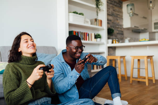 istock Happy young diverse couple relaxing at home 1283345918