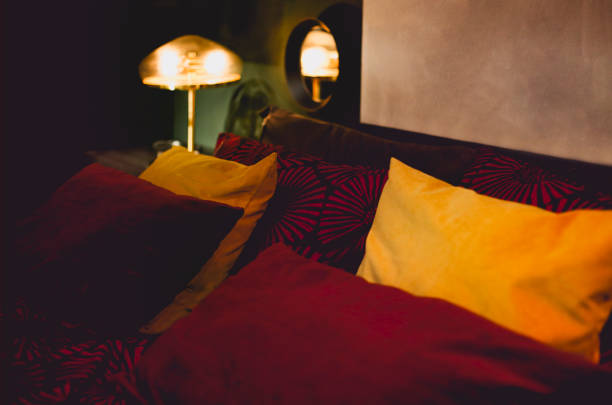 istock Cozy bedroom with burning lamp 1283346462