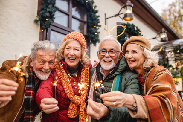 istock Seniors celebrating Christmas outdoors 1283348198