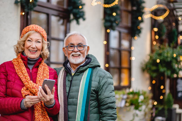 istock Senior couple is using mobile phone outdorrs 1283348234