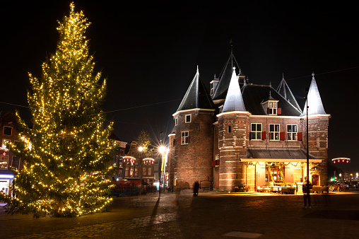 Christmas in Amsterdam at the Nieuwmarkt. The Nieuwmarkt has been an Amsterdam market since the 17th Century. The picturesque building known as De Waag,it was previously a weigh house, medical college and now is a restaurant.