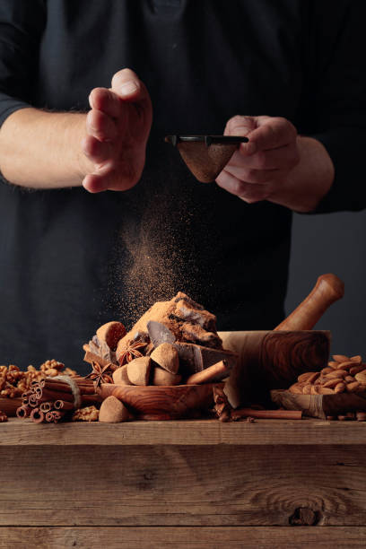 istock The cook sprinkles the chocolates with cocoa powder. 1283351898