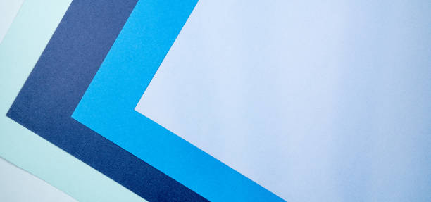 istock Multi colored abstract paper of pastel blue colors palette, with geometric shape. 1283353275