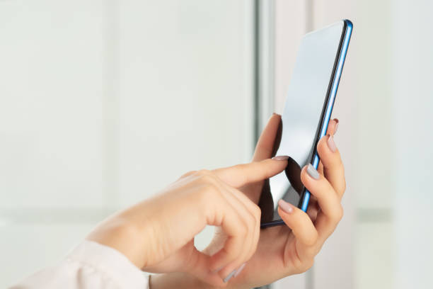 istock female hands uses the smartphone SMS, social media, mobile apps 1283353646