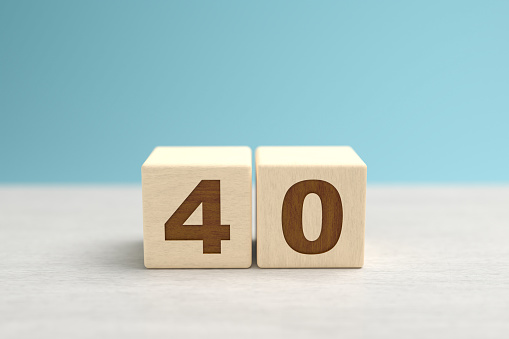 Wooden toy blocks forming the number 40.